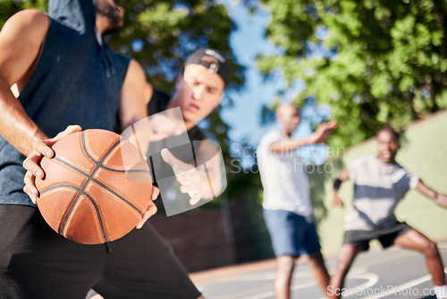 Image of Fitness, sports and friends on a basketball court playing a game, training match and cardio workout exercise. Teamwork, diversity and healthy men enjoy a challenge with intensity in summer together