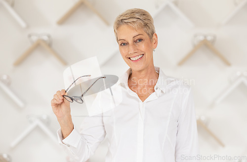 Image of Glasses, vision and eyesight with a woman customer buying prescription lenses at the optometrist. Portrait, eyewear and retail with a mature female consumer spending money on spectacles in a store