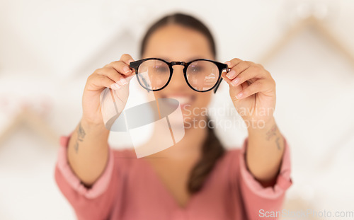 Image of Vision, eyesight and woman with glasses in hands for eye test, holding spectacles in blurred background. Healthcare, medical insurance and eyes, girl in blur with prescription lens in spectacle frame