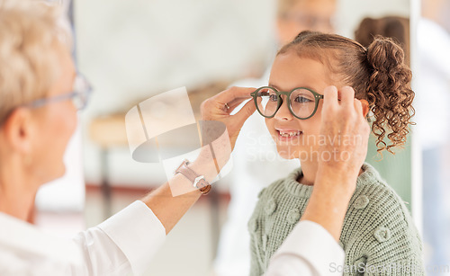 Image of Vision, eye care glasses and child with optometrist for ophthalmology consultation, help or support with eyesight. Healthcare service, optical check and expert consulting youth patient at eye exam