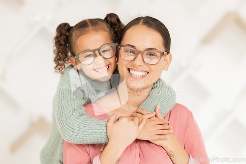 Image of Eye care, glasses and child hug mother with new vision lens, prescription eyeglasses or ocular support spectacles. Eyesight, healthcare service and portrait of happy family at optometry retail store