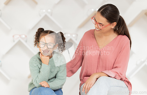 Image of Shopping, vision and glasses with mother and girl buying eyewear together in retail store. Woman, daughter and consumer optics while buy eyeglasses in optometry shop for eye health and eye care