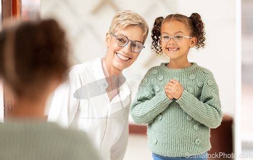 Image of Store, shopping and vision with girl and glasses for eye care and eye health buying frames in retail shop. Optometry, ophthalmology and child customer being helped with eyewear by optometrist