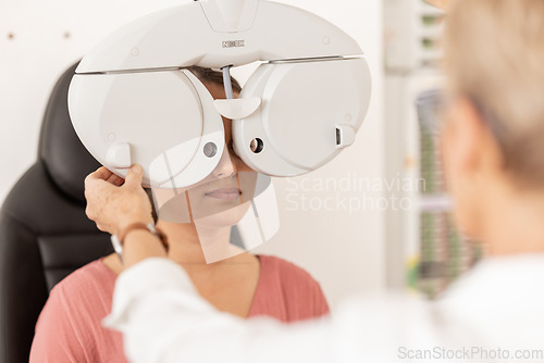 Image of Vision, consulting and lens exam of woman with expert eyecare professional in glaucoma testing clinic. Ophthalmologist, doctor and machine with girl patient at consultation appointment.