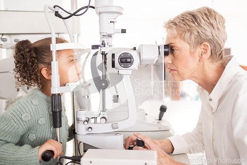 Image of Eye, test and child vision exam for health, wellness and eye care with a medical doctor or optometrist. Equipment, ophthalmology and female kid in optometry examination for glasses and eyewear
