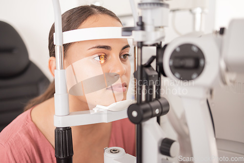 Image of Vision, ophthalmology and woman in eye exam with light on iris at eye doctors office. Healthcare, medical insurance and eyes, girl getting healthy visual refraction eye test at ophthalmologist clinic