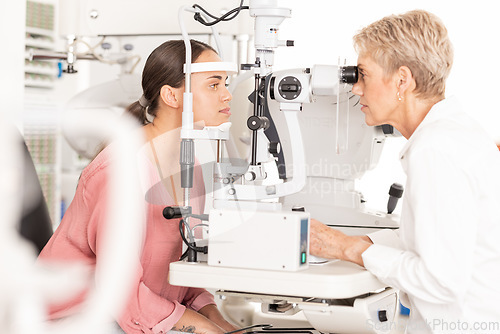 Image of Eyes, doctor and eye exam by woman consulting ophthalmologist for vision, eye care and sight at clinic. Optical, exam and eye health by women in a consultation room for optometry, check and diagnosis
