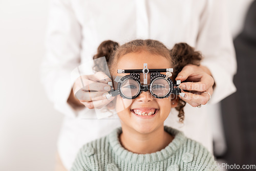 Image of Vision, optometrist and portrait of child with glasses to test, check and examine eyesight. Healthcare, medical and young girl in doctor office for eye examination, optical diagnostic and examination