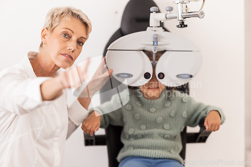 Image of Vision, eye and test with a child at optometry exam with a specialist doctor in a clinic for glasses. Ophthalmology, optometry and medical expert eye test with little girl for eye health and eye care