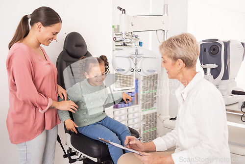 Image of Consulting, mother and child with an eye doctor for healthy eyes, vision and retina wellness optical test. Smile, mom and happy girl at an optometrist with an optician writing results for an exam