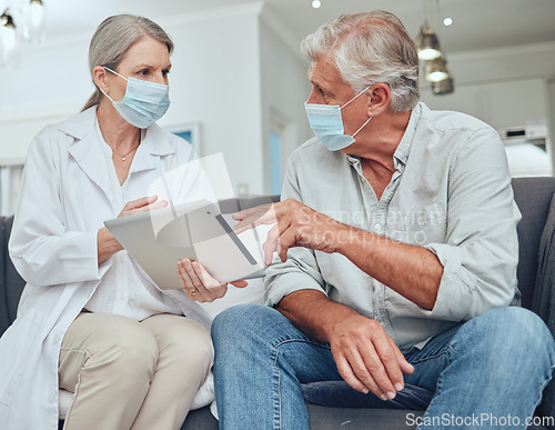 Image of Senior doctor, covid mask and digital tablet patient results in a hospital or wellness clinic. Healthcare consulting, insurance talk or health nurse consultation of elderly people speaking together