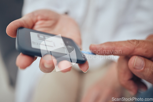 Image of Healthcare, diabetes and senior man with glucometer checking blood sugar level on finger closeup. Health, innovation and medicine, daily life of diabetic with home test to check blood glucose levels.