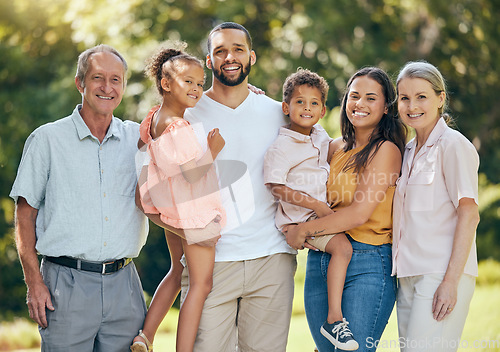 Image of Portrait, family and park with kids, parents and grandparents bonding in summer, relax and happy in nature. Smile, love and children having fun with interracial, happy family and cheerful in a garden
