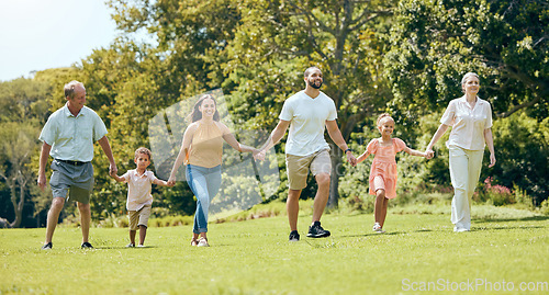 Image of Grandparents, parents and kids walking in the park, happy .and bonding together outdoor. Family, holding hands and fun being loving, happiness and adventure on vacation, spend quality time and love.