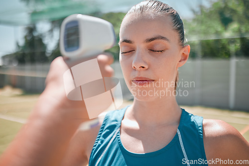 Image of Woman, sports and healthcare test with thermometer for temperature, safety or check on the court outdoors. Active female in sport fitness getting checked for fever or illness with infrared device