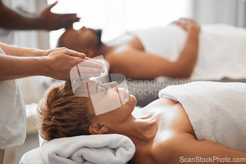 Image of Woman, head and spa massage of couple at beauty salon, holiday resort and wellness vacation, face cosmetics and peace in Bali. Black woman, luxury facial and relax treatment from skincare therapist