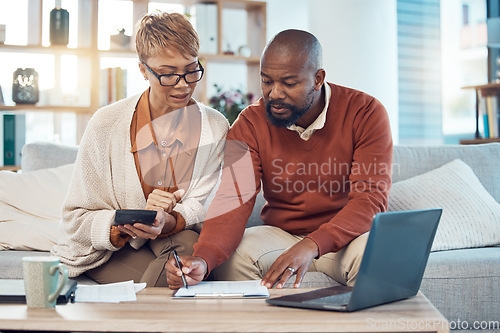 Image of Documents, laptop and couple with calculator writing, planning or calculate financial budget, savings or bank payment. Mortgage insurance, taxes and black woman and man review accounting finance data