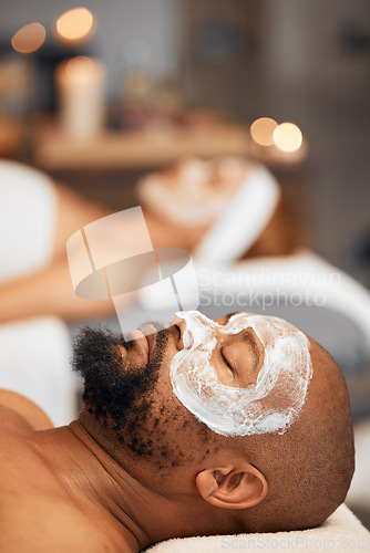 Image of Spa facial, skincare and couple with face mask for luxury self care routine, glowing skin or wellness treatment. Beauty product, healthcare support and black woman and man relax with salon face cream