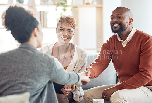 Image of Black couple, financial advisor and handshake on home sofa for discussion with broker and shaking hands for agreement, contract and deal. Happy man and woman talking to agent for insurance or loan
