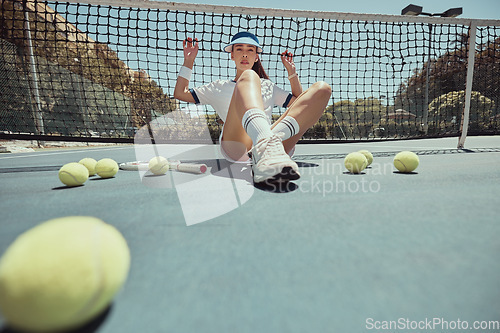 Image of Woman, tennis ball and sport with girl against net on court after exercise, workout and training for competition outdoor. Aesthetics, athlete and fashion with female on tennis court for wellness