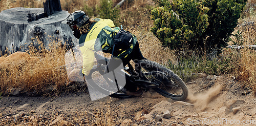 Image of Mountain bike speed, dust on ground from fast drift turn and race, rally or competition outdoor. Extreme sports cycling, sand dirt rocks and cyclist man, ride to win contest or downhill on mountain