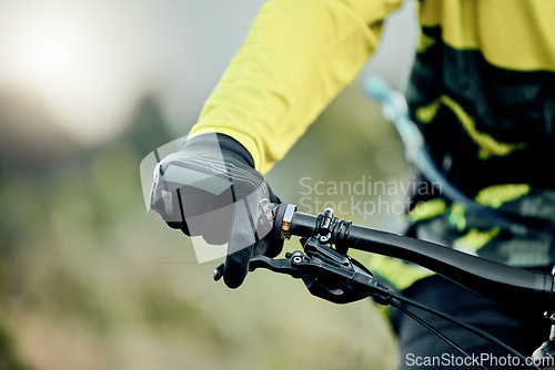 Image of Cyclist hand, bike handlebar brake and safety on tour, race or ride for fitness, health and wellness in nature. Bicycle handbrake, adventure mountain bike and control speed while outdoor for cycling