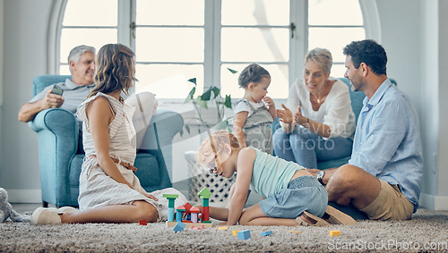 Image of Big family, bonding and children playing in living room, relax and cheerful in their home together. Happy grandparents, parents smile and enjoy fun, watching kids play on floor while resting on couch