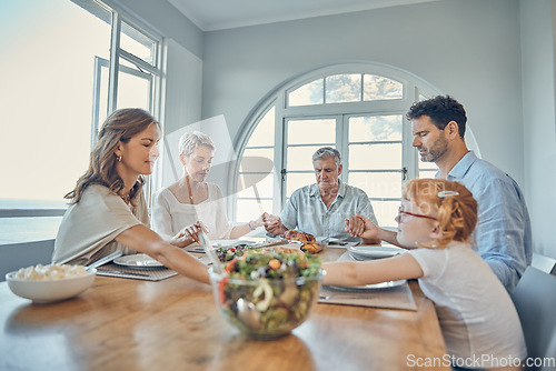 Image of Lunch, praying and family together at dining room table in home. Grandparents, child and parent teaching grace or spiritual religion prayer respect to kid before dinner in religious retirement house