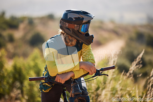 Image of Bike, athlete and sport outdoor, cycling and break with helmet for safety and fitness with mountain bike through woods. Biker with bicycle, nature and extreme sports, relax and rest after exercise.