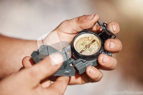 Image of Hiking man, hands or pocket compass in travel location, camping ground direction or destination arrow map. Zoom, navigation device or magnetic north guide for nature camper in countryside environment