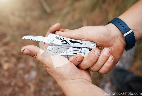 Image of Man, multi purpose knife and camping in nature, forest and survival gear for adventure in mountains, woods and park. Guy hands, pocket tools and practical swiss metal weapon object for outdoor hiking