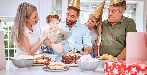 Image of Children, family and birthday with parents and grandparents celebrating the party of a boy together in the home. Cake, celebration and event with a mother, father and relatives celebrating their son