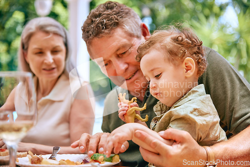 Image of Food, grandpa and baby on lap eating vegetables for healthy, diet and nutrition in family home. Help, health and elderly grandparents teaching child grip for child development and wellness.