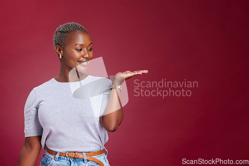Image of Studio woman, advertising mockup and red background, marketing space and blank wall design for presentation, product placement and promo commercial. Happy young black model, mock up and offer advice