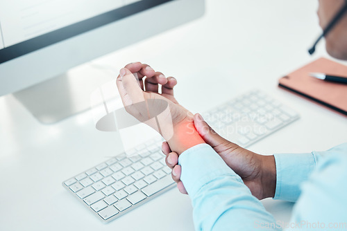 Image of Businessman, hands injury or office carpal tunnel by computer in call center, contact us or customer support company. Wrist pain, stress or technology muscle tension abstract for telemarketing worker