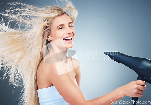 Image of Beauty, hair care and portrait of woman with hair dryer for bathroom routine, wellness treatment or beauty salon self care. Healthcare, clean hairstyle or happy aesthetic model with luxury blow dryer