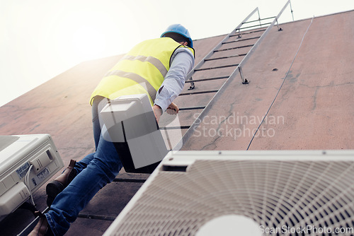 Image of Solar energy, construction and worker on ladder for building, solar power and maintenance of renewable energy. Industrial employee climbing on a warehouse or house as handyman or construction worker