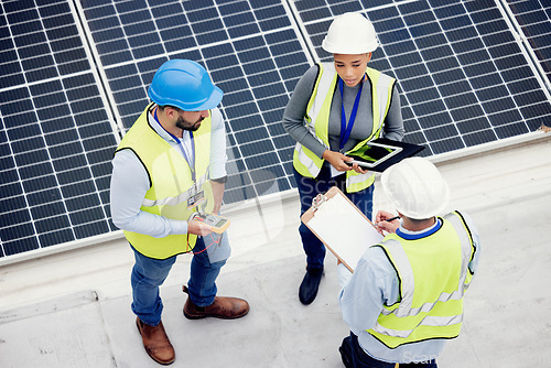 Image of Top view, engineer teamwork and planning of solar panel maintenance, inspection or installation. Solar energy, renewable energy and group of contractors with tablet, tech or checklist in discussion.