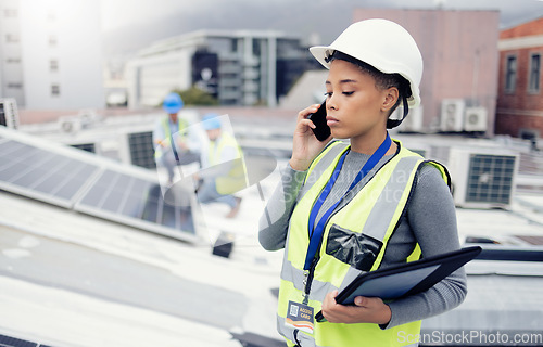 Image of Engineer woman talking with phone, solar energy on roof and sustainable renewable energy in construction. Building manager, working with eco friendly solar panel or electricity maintenance project