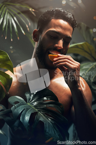 Image of Beauty, tropical and model eating fruit in jungle for health, diet and wellness nutrition in paradise. Palm trees, exotic and hydrated skincare of man with healthy and natural food detox.