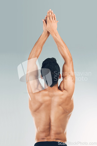 Image of Sports man, stretching back muscle for start of swimming dive in fitness workout on gray studio background. Bodybuilder spine with power pose, strong athlete stroke and exercise training health