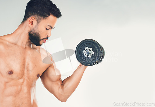 Image of Fitness, muscle and man with dumbbell for weightlifting and body workout, strong and bicep against white studio background. Bodybuilder, weight training and strength endurance in exercise mockup.