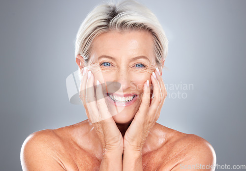 Image of Portrait, senior woman and beauty, skincare and wellness in studio for grooming, hygiene and pamper routine on grey background. Face, elderly model and happy, smile and excited about facial treatment