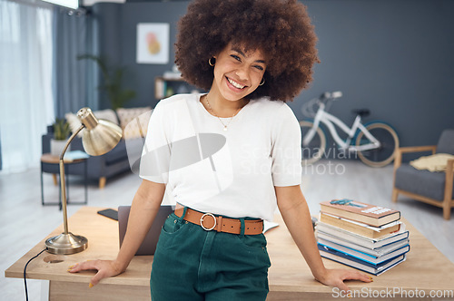 Image of Portrait, black woman and happy in her home office, relax and smile and living room workspace. Woman, freelance and entrepreneur excited about remote work, proud and vision for startup business