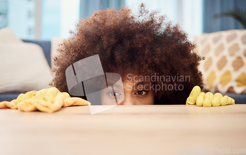 Image of Cleaning, living room table and black woman with clean rubber gloves inspection and check for dust. Morning house chores, maid and cleaner working in a home lounge looking and searching for dirt