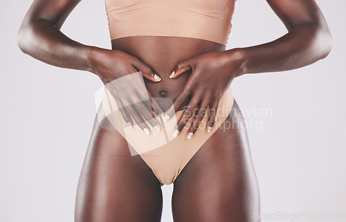 Image of Healthy black woman, heart hands and stomach diet, weightloss wellness and gut health, body contouring and slimming on studio background. Fitness model abdomen, love and digestion, skincare and belly