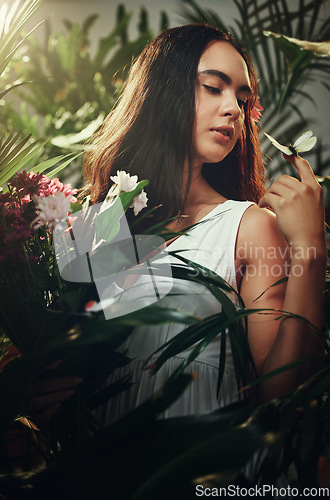 Image of Woman, tropical rainforest and face beauty wellness for skincare treatment outdoors, Young girl model, cosmetic facial makeup and body care or calm lifestyle with flower plants in nature outside