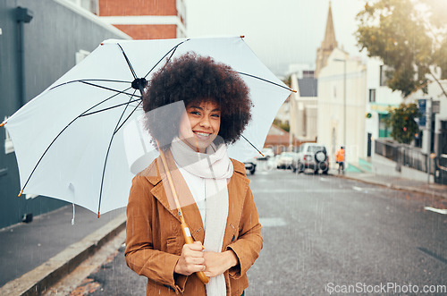 Image of Woman, fashion and umbrella portrait in winter city while travelling and sightseeing. Tourist, style and happy young female student commuting in an urban town in cold weather during autumn