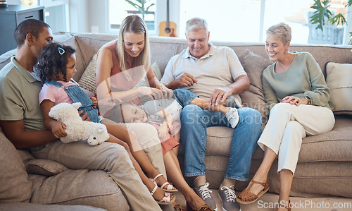 Image of Big family, happiness and love on house sofa with children, parents and grandparents together for bonding, quality time and relax. Happy kids, women and men in interracial family home in Europe