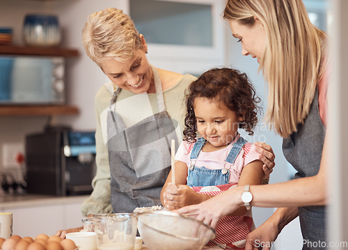 Image of Grandma, mother and child baking in kitchen together while girl learns to mix cake mixture, pancake batter or muffin mix. Family cooking dessert, kid learning and cooking snack food for home dinner